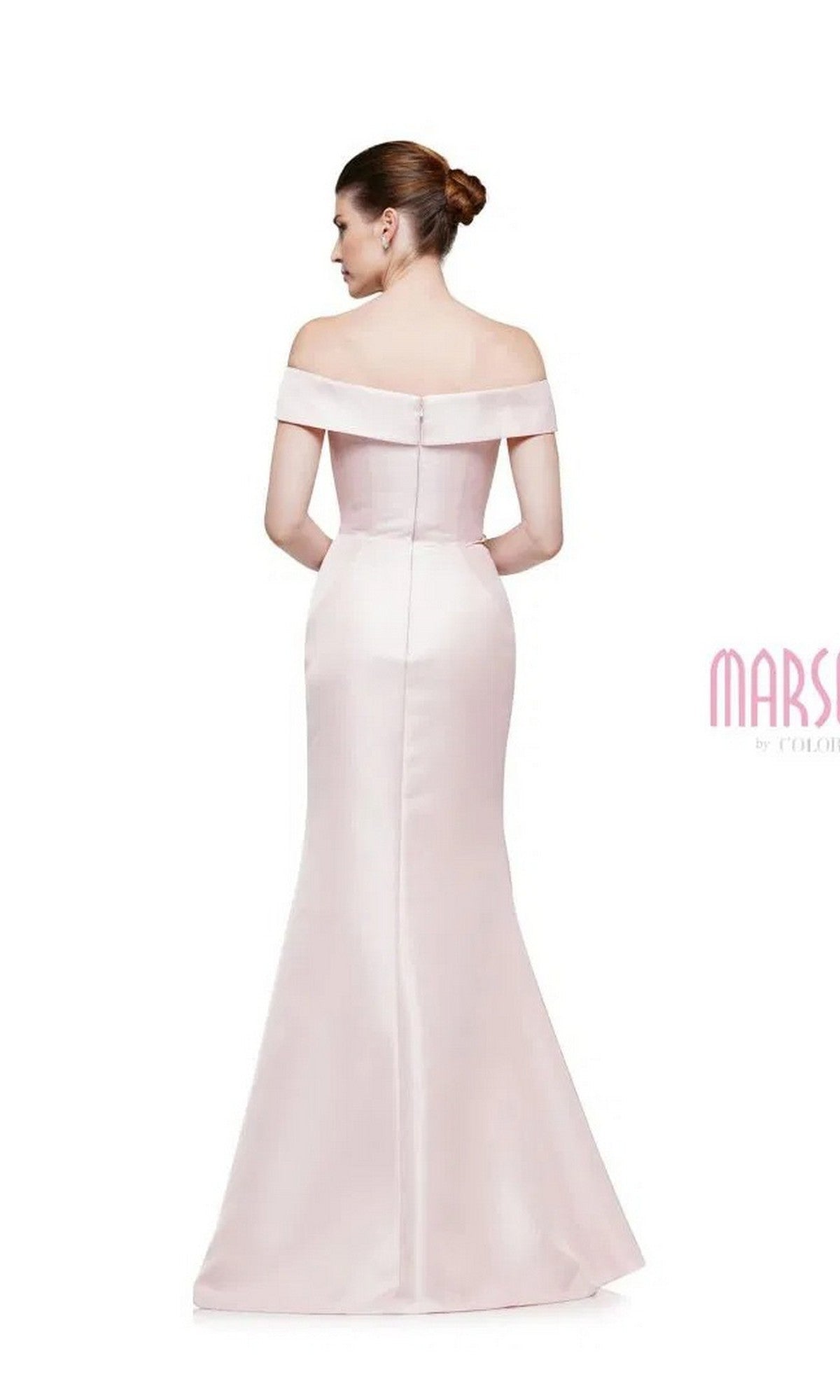 A woman in the Marsoni MV1003 long formal dress, featuring off-the-shoulder satin and beaded floral embellishments, stands facing away with her hair styled in a neat bun.